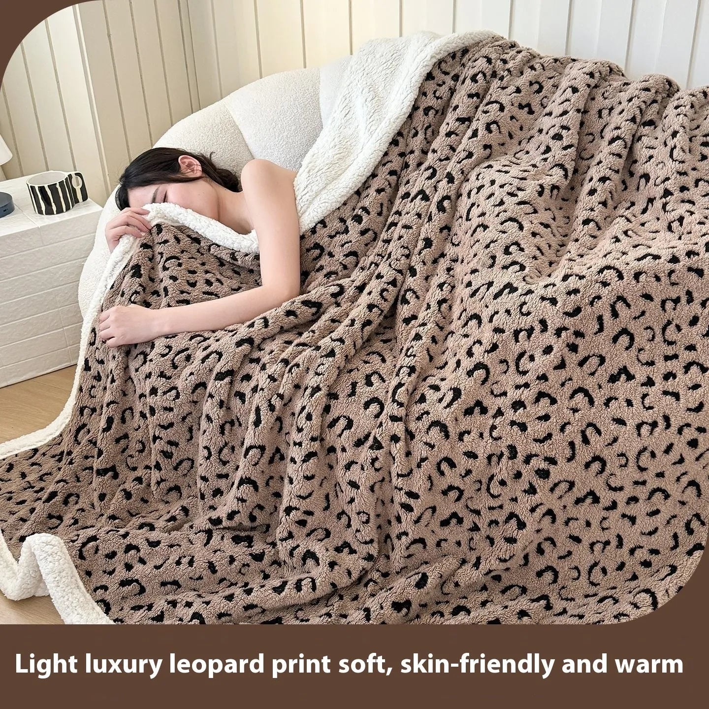 Double-layer Jacquard taffeta blanket with leopard print design in camel colour folded to show texture and pattern detail