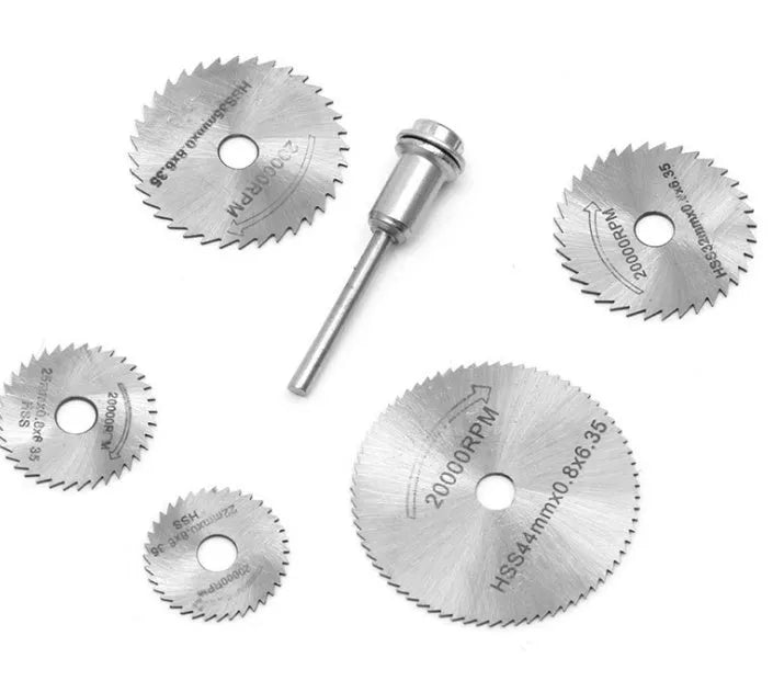 Set of six small circular high-speed steel saw blades and a mandrel on a white background