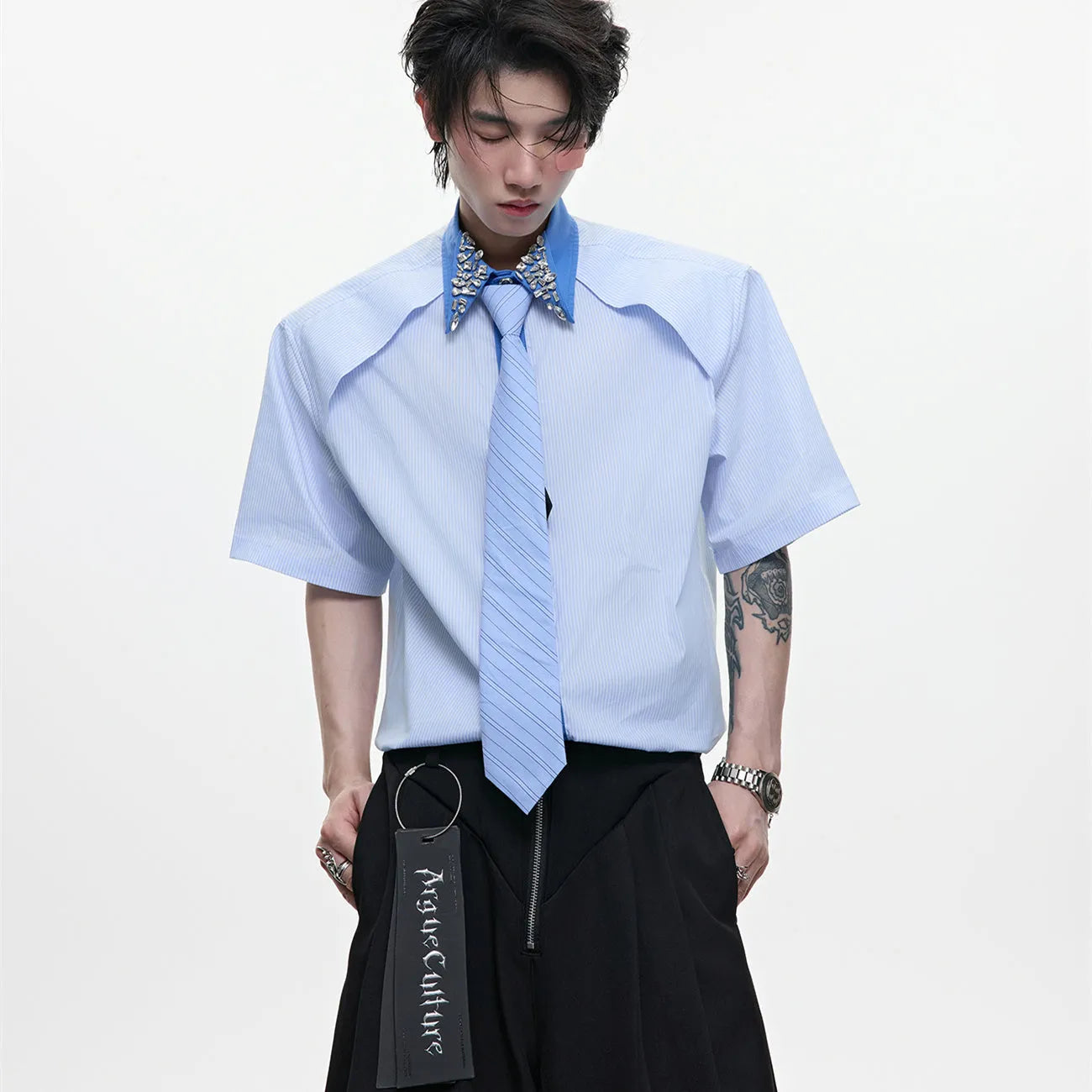 Men's blue loose fit diamond tie patchwork striped shirt with flip collar and button decorations.