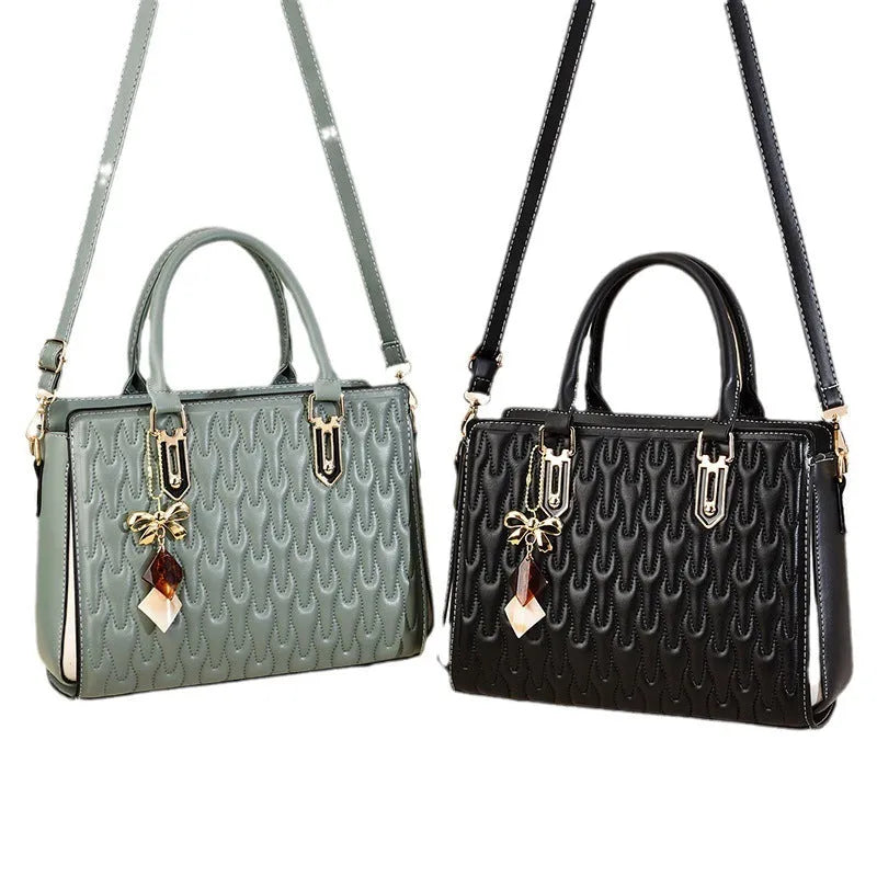 Women's large-capacity polyester messenger bag in black, showing pocket sandwich organisation