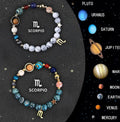 Set of twelve natural stone beaded bracelets for each zodiac sign arranged together.