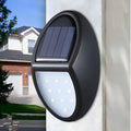 Black solar-powered LED wall light with automatic sensor measuring 75mm by 120mm