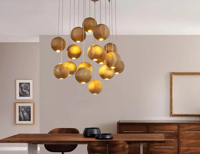 Nordic-style wooden ball chandelier with adjustable cord, shown in single-head and three-head styles on a wood disc base.