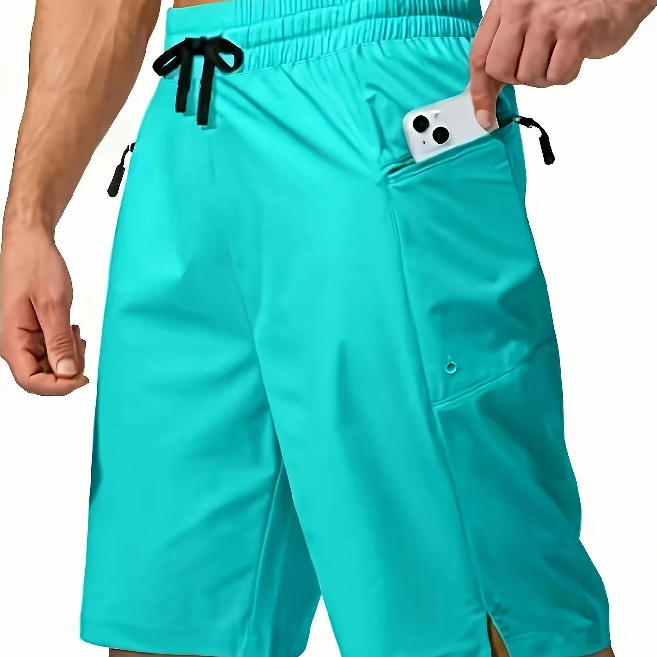 Man wearing solid grey quick-drying polyester beach shorts with a straight leg design.