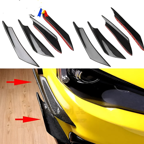 Set of four black ABS plastic bumper blade spoilers for car modification on a white background.