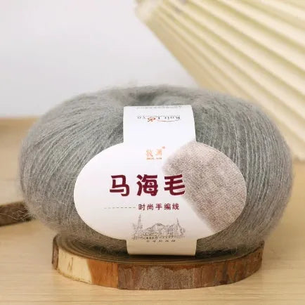 Single ball of mohair yarn in various colours for hand-woven DIY scarf knitting projects