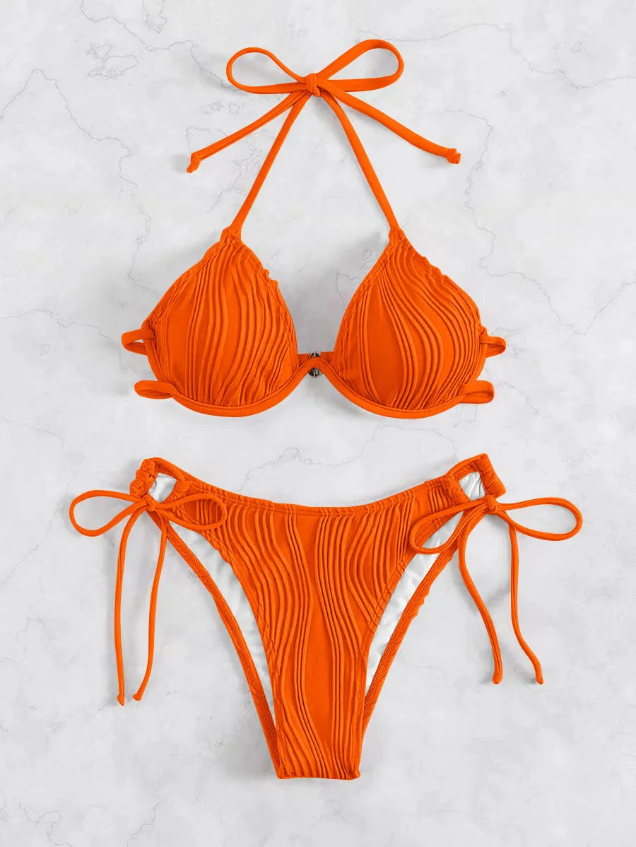 Women's apricot coloured underwire bikini swimsuit with adjustable side-tie bottoms on a mannequin.