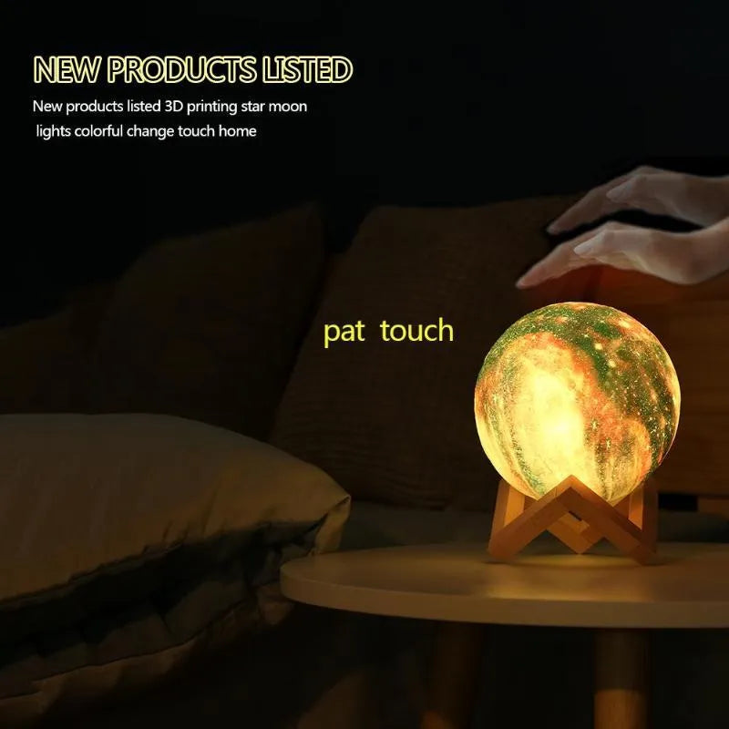 3D printed spherical moon night light with textured surface, shown with remote control.