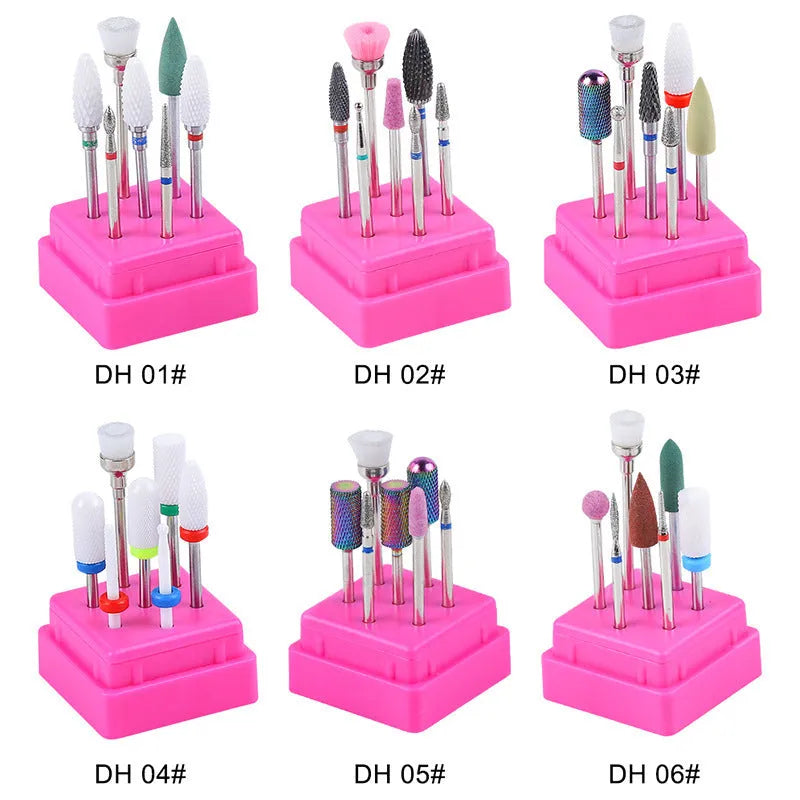Set of seven tungsten steel nail drill bits and a brush in a transparent storage case.