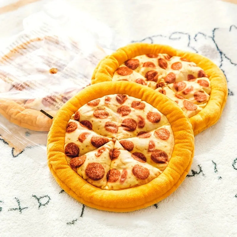 Yellow pizza slice shaped rubber dog chew toy with textured ridges and a squeaker.