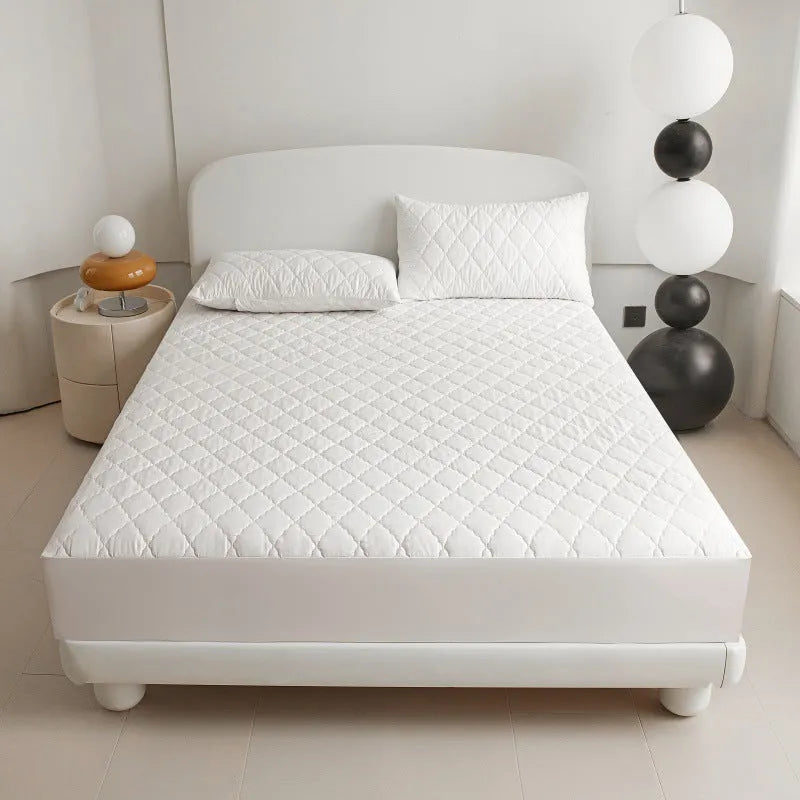 Diamond lattice quilted waterproof mattress protector set with bamboo fibre fitted sheet and pillowcases.