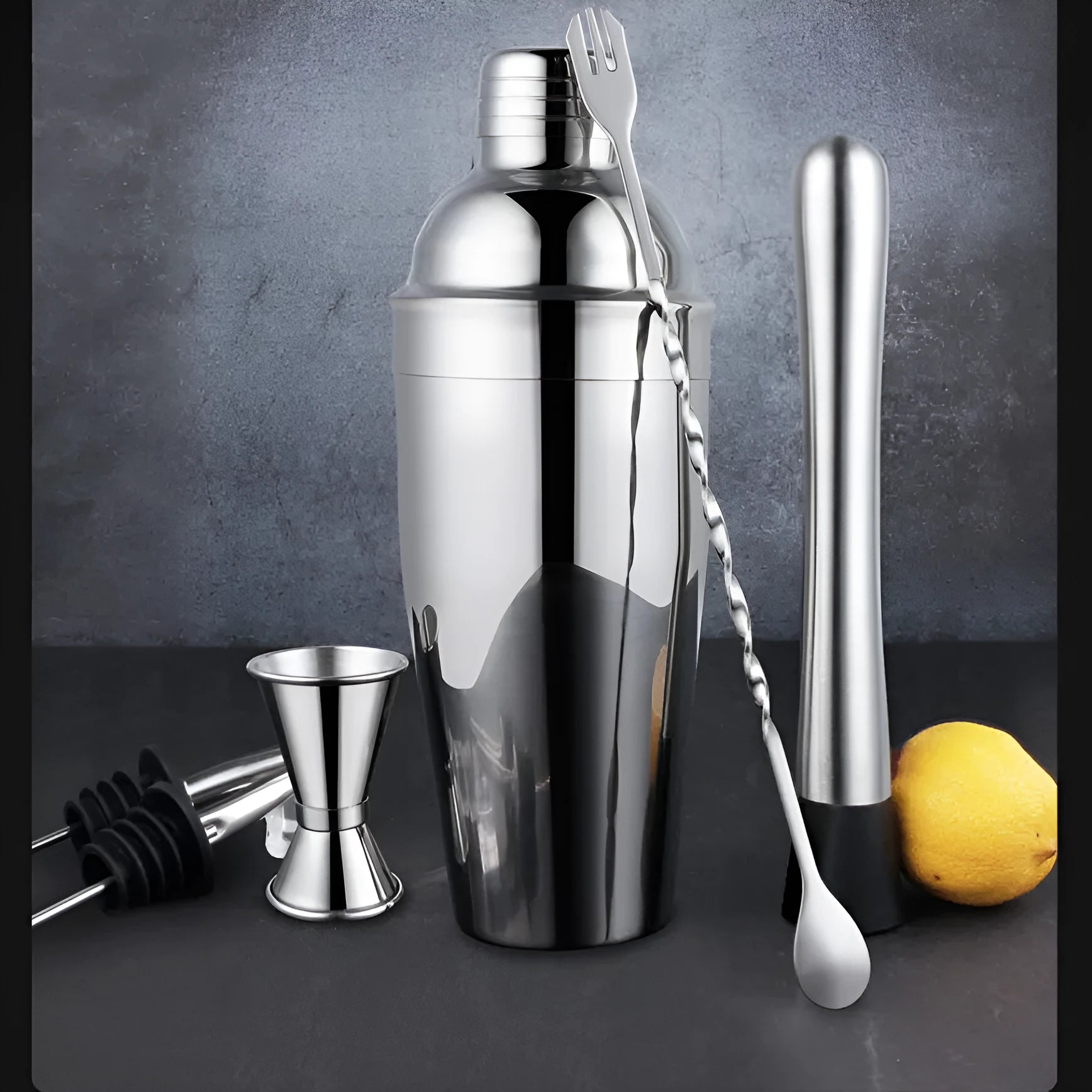 23-piece European style cocktail set with stainless steel bar tools arranged on acrylic display