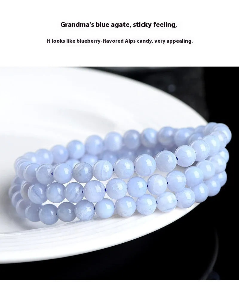 Blue agate bracelet with natural striped beads and Ruyi design elements