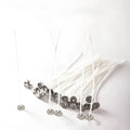 Close-up of white cotton candle wicks showing tightly woven texture and different lengths of 2.6cm, 6cm, and 8cm.