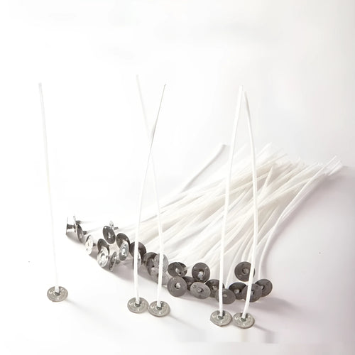 Close-up of white cotton candle wicks showing tightly woven texture and different lengths of 2.6cm, 6cm, and 8cm.