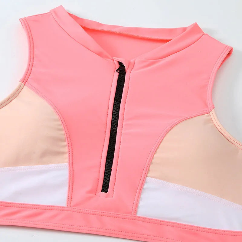 Pink high waist bikini swimsuit with brief style bottoms on a mannequin