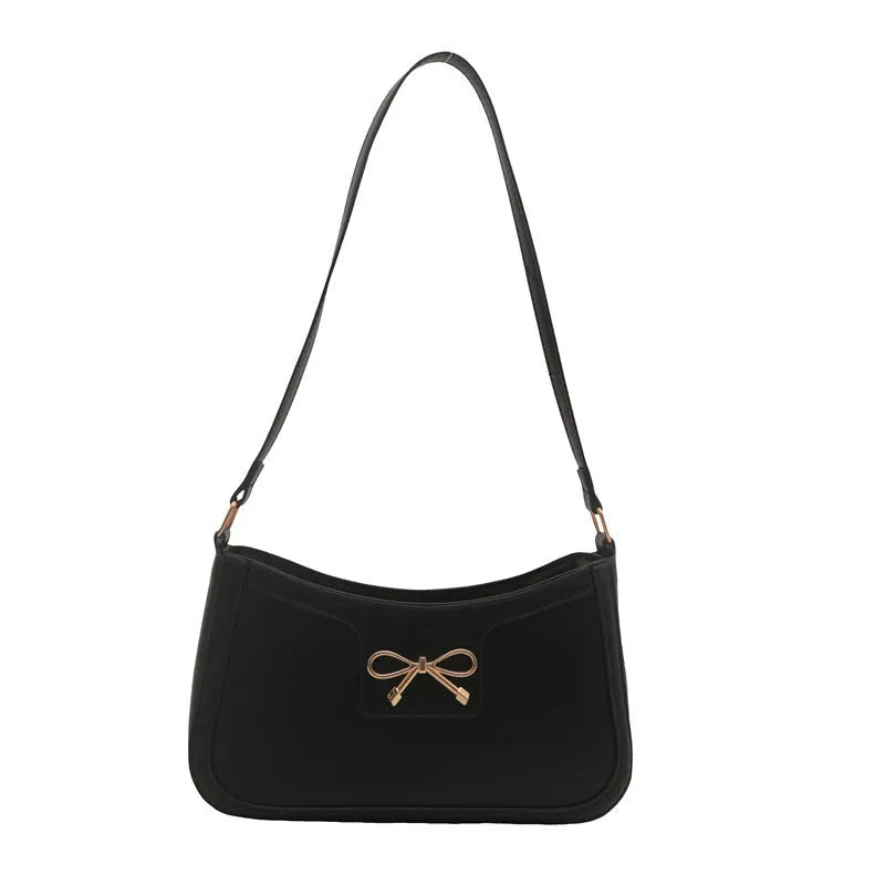 Western style PU leather shoulder bag with bow detail in horizontal square shape.