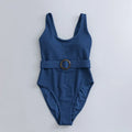 Navy blue women's one-piece slimming swimsuit with triangle top and chest pads on a white background.