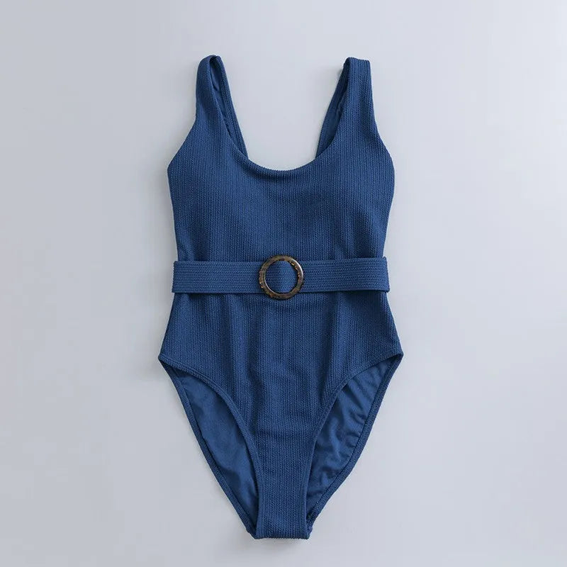 Navy blue women's one-piece slimming swimsuit with triangle top and chest pads on a white background.