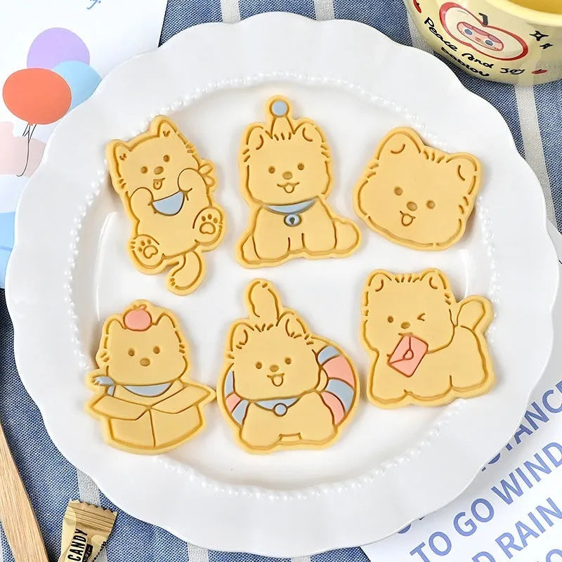 3D plastic biscuit mould with cartoon dog shapes including puppy head and birthday hat
