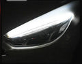 Universal car LED daytime running light strip with flowing turn signal on a vehicle headlight.