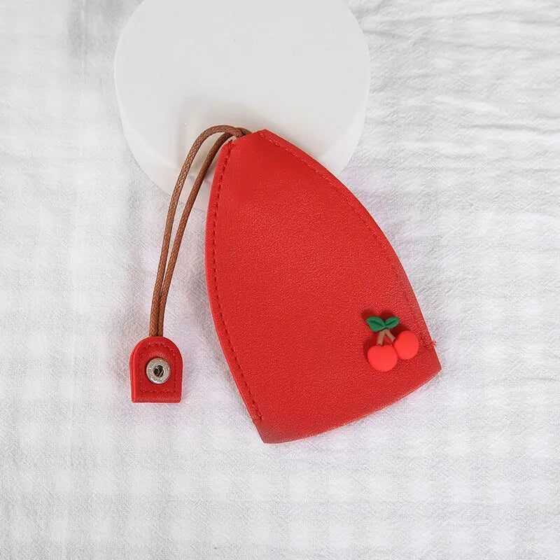 Cartoon pull-out car key case in PU leather with colourful designs measuring 14 x 7.5 cm
