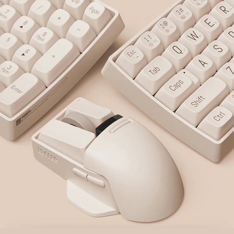 Xiaoqiao tofu colour wireless mouse with seven buttons and a scroll wheel on a desk.