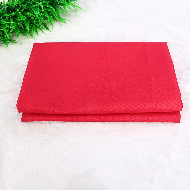 Square red car pet pad made of Oxford fabric with waterproof backing, shown on a car seat.