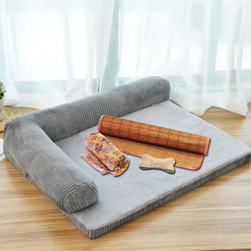 Corduroy fabric pet sofa dog bed in a grey colour, showing raised sides and plush high-density sponge padding.