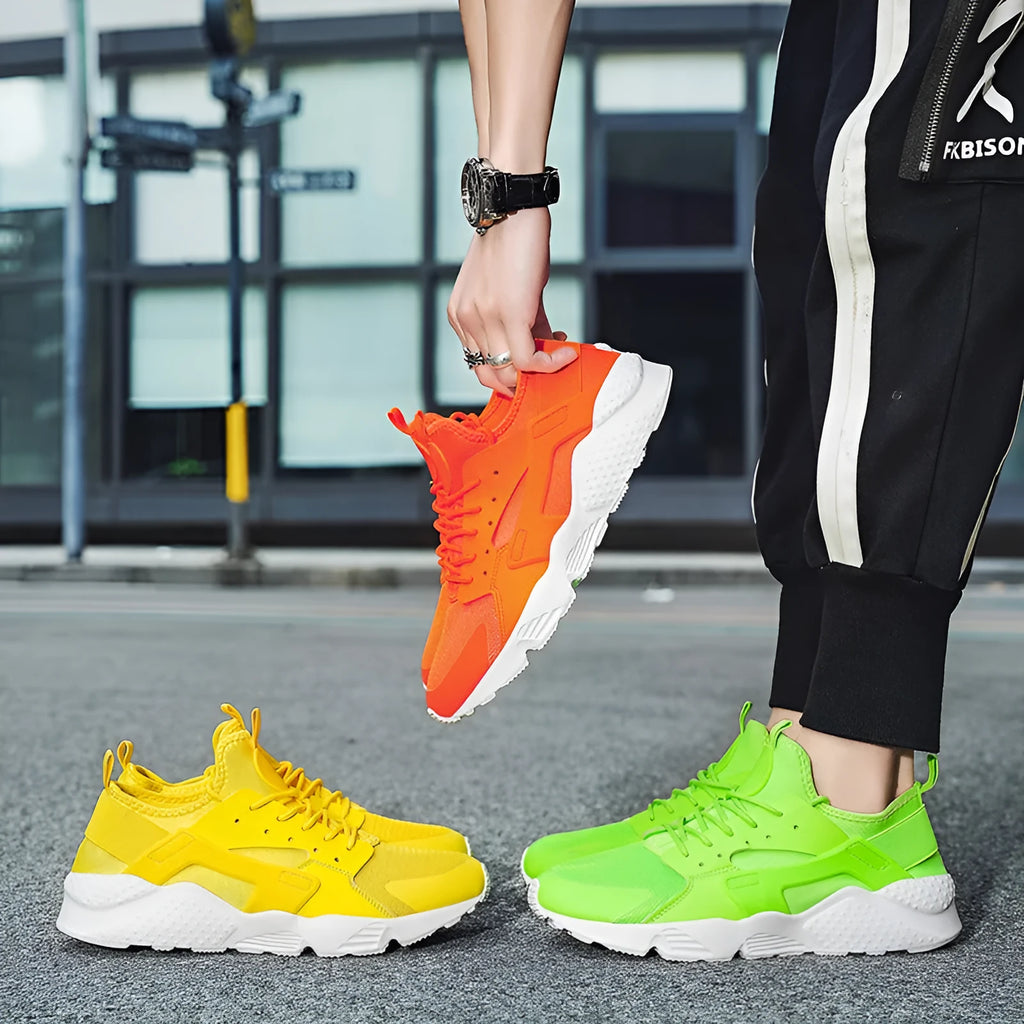 Men's low top casual shoes in green with mesh upper, flat heel, and lace-up front closure
