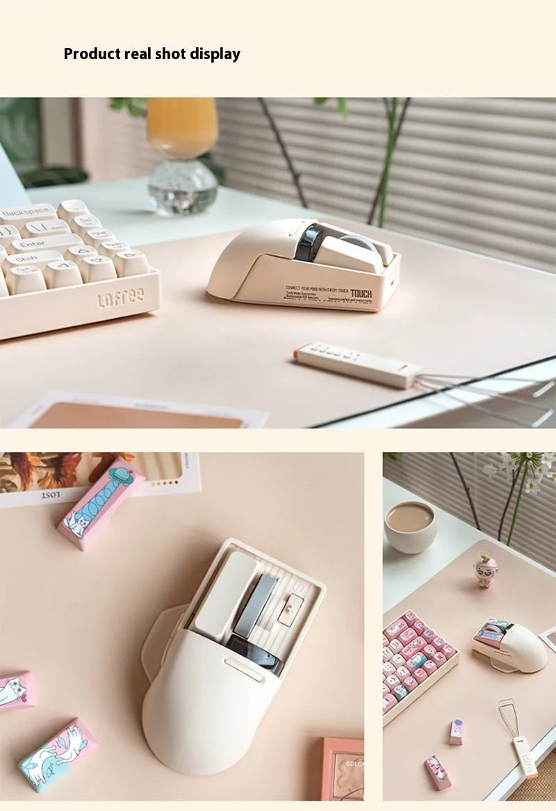 Xiaoqiao tofu colour wireless mouse with seven buttons and a scroll wheel on a desk.