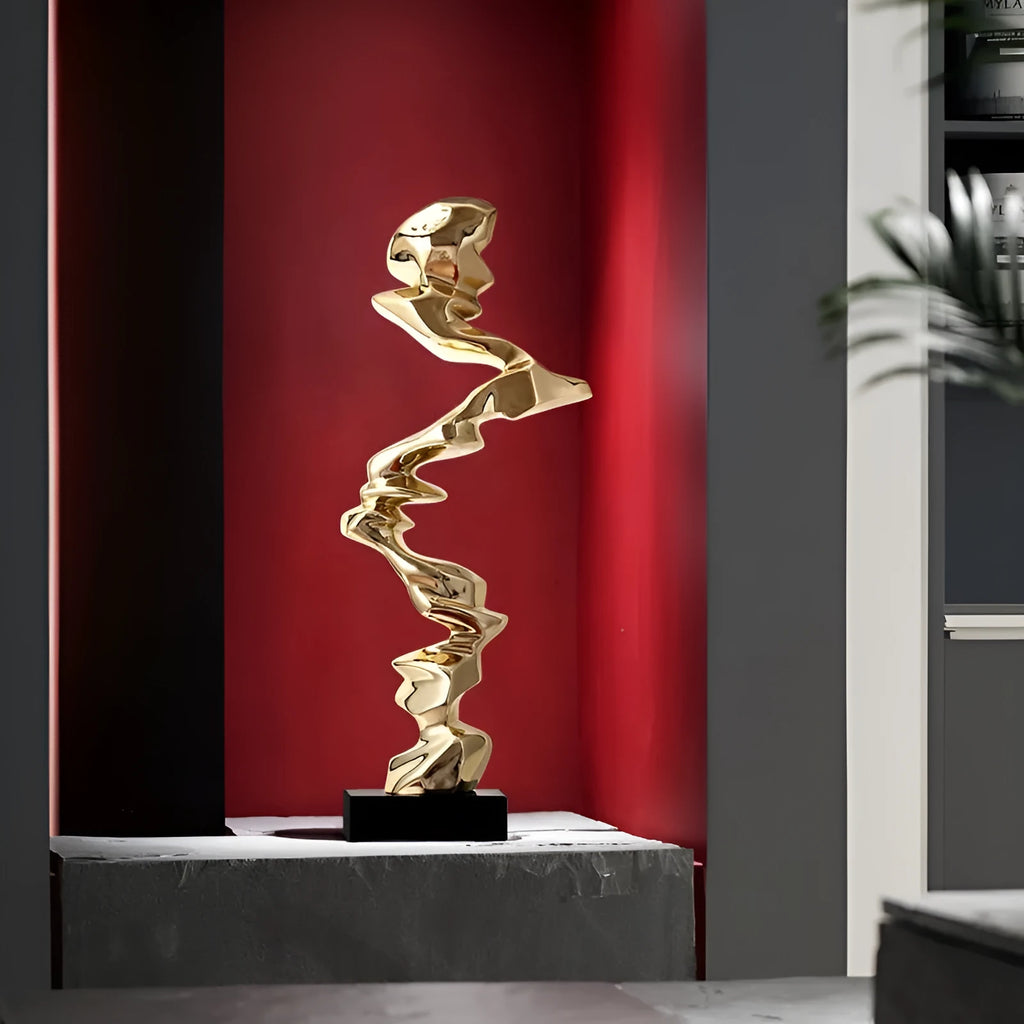 Minimalist abstract resin decorative sculpture in bright gold, silver, or blue.