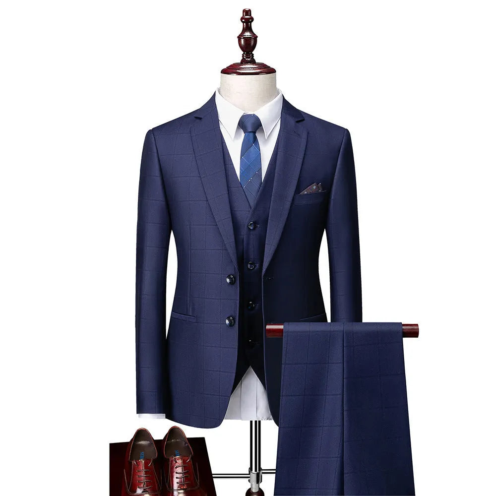 Men's navy blue slim fit plaid three-piece suit with vest, jacket, and trousers on a hanger.