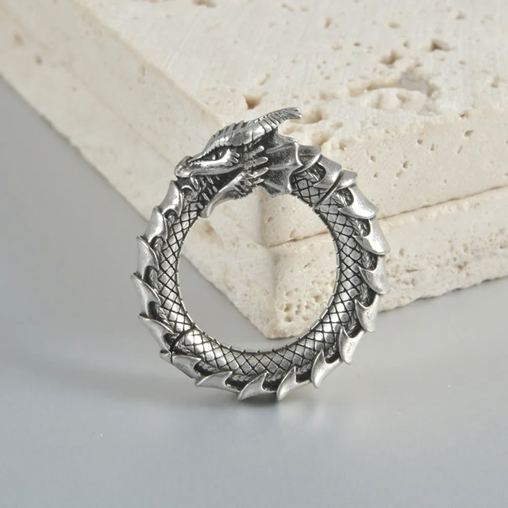 Geometric hollow-out earrings with antique silver dragon finish in copper auricle style