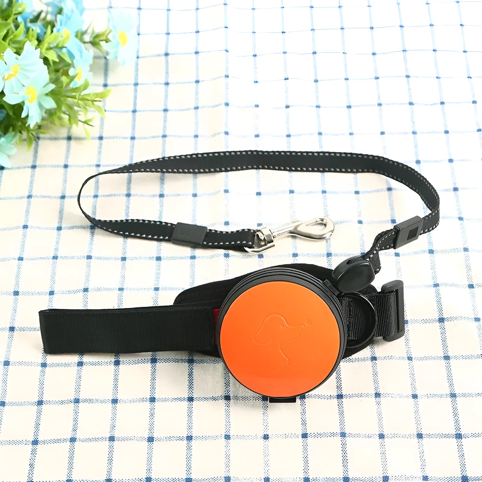 Pet Holding Hands automatic retractable dog leash extended, showing nylon cord and ergonomic handle.