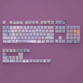 Wenshao Sleeping Lotus PBT key cap set showing side-carved transparent characters and complete 130-key layout