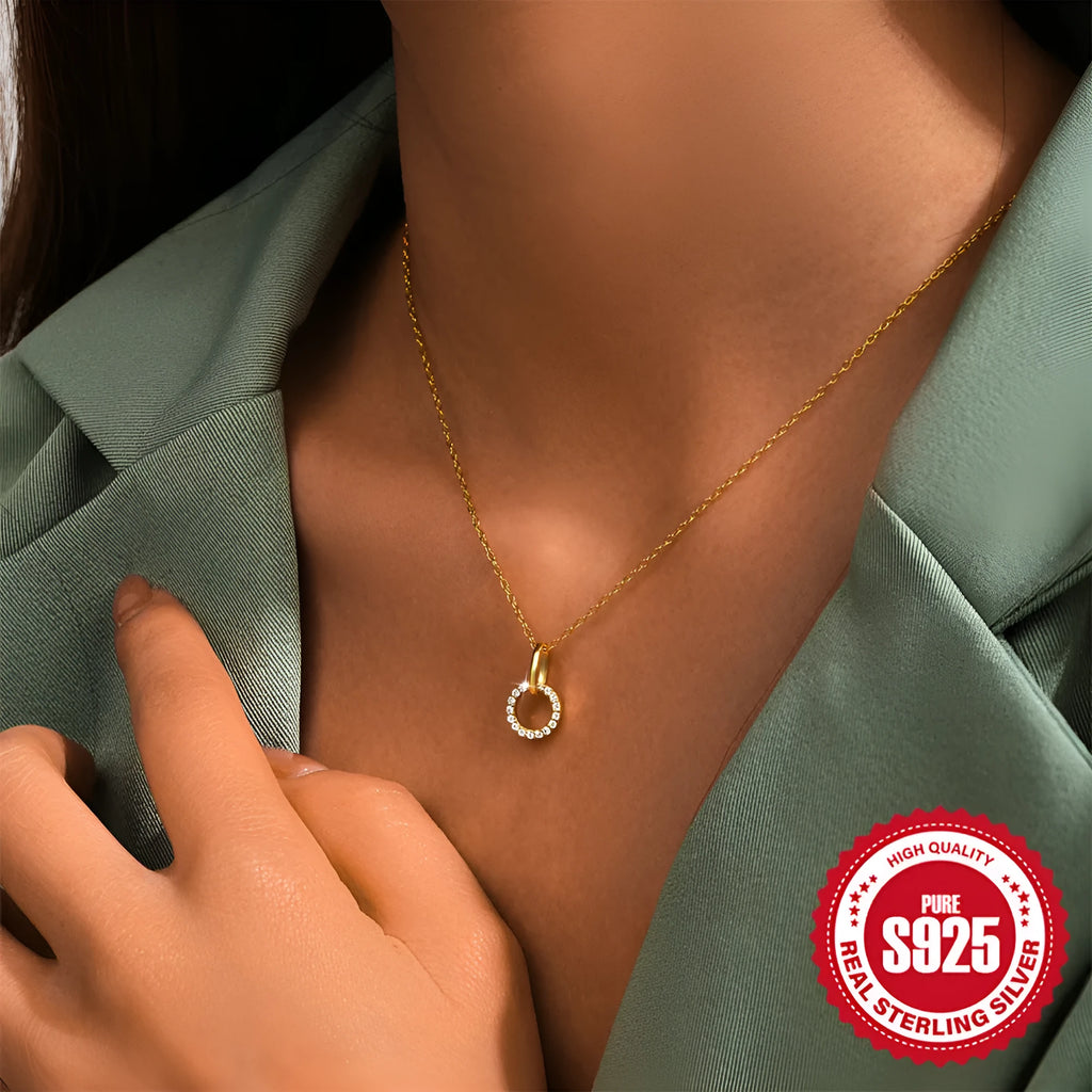 Gold colour sterling silver clavique chain necklace with interlocking zircon design on model