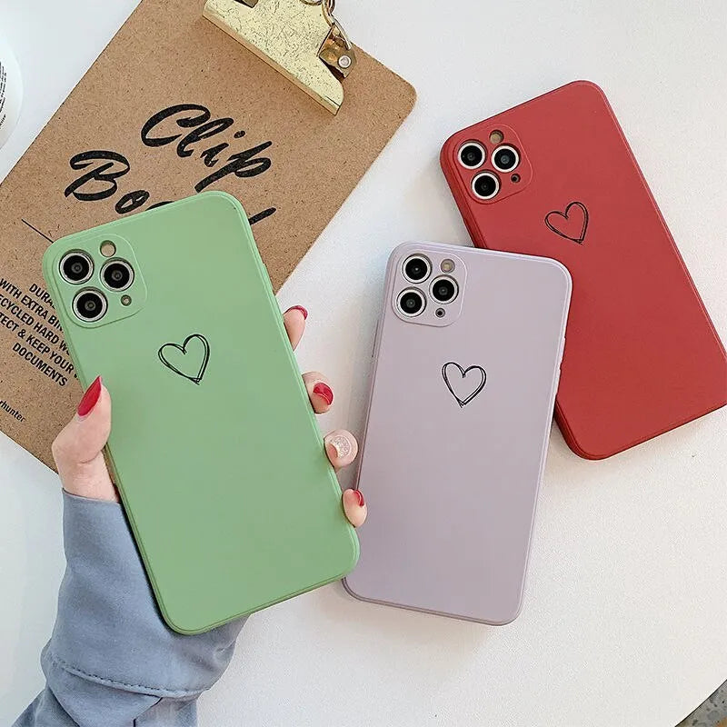 Silicone TPU back cover case for iPhone in solid colours like black, pink, and green on a white background.