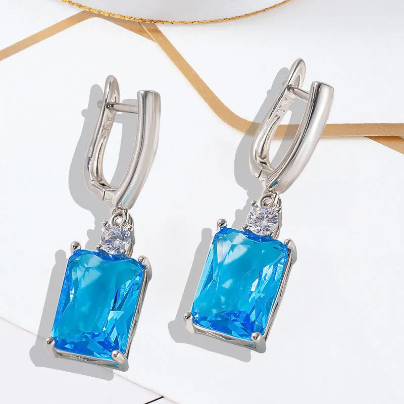 Square geometric copper earrings with electroplated gold finish and quadrilateral design elements