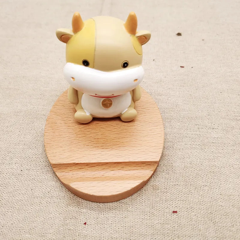 Solid beech wood mobile phone holder with detailed resin animal carving in choice of 22 animal styles