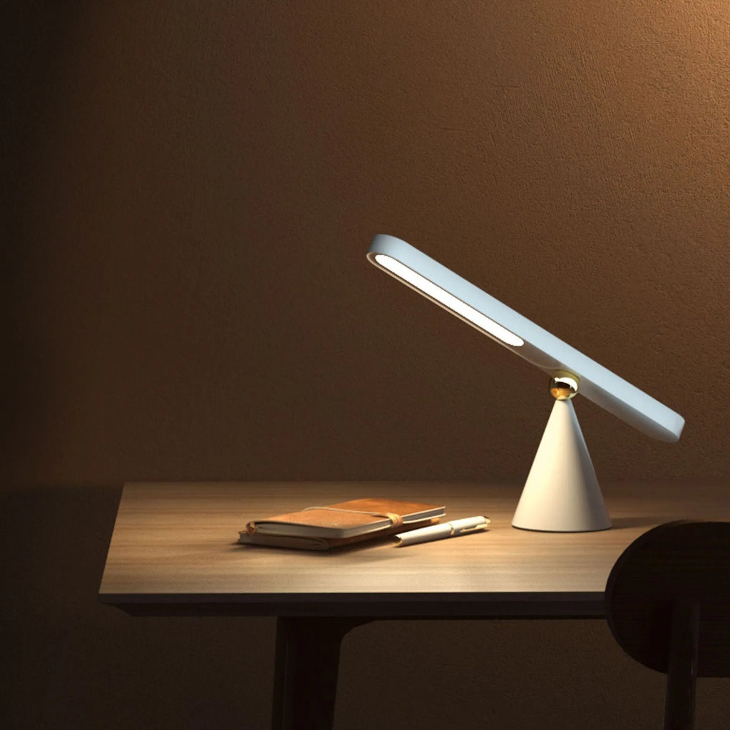 Geometric table lamp with magnetic suction base showing white and khaki colour options