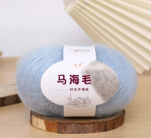 Single ball of mohair yarn in various colours for hand-woven DIY scarf knitting projects