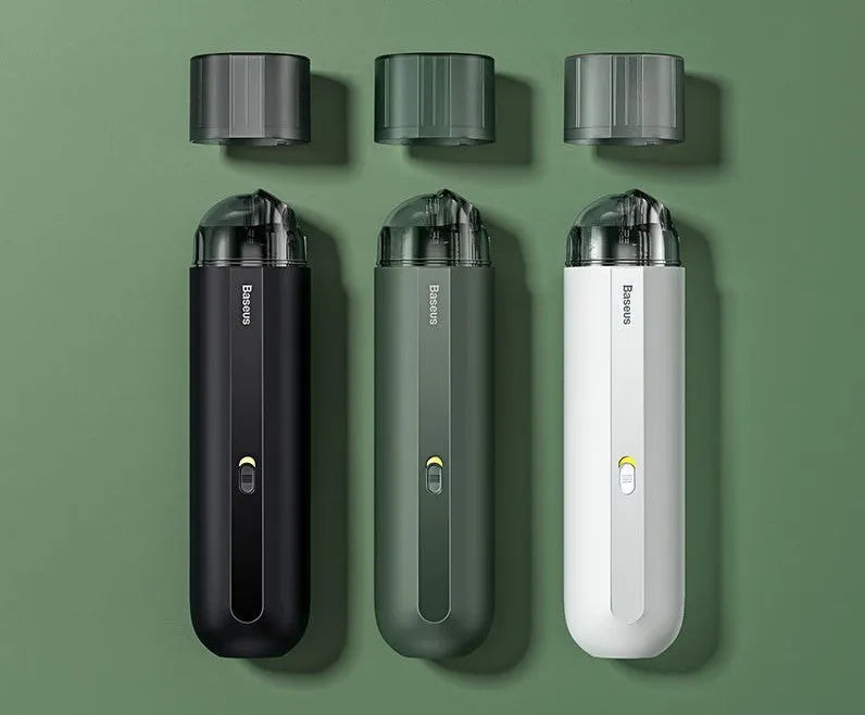BASEUS black handheld car vacuum cleaner with hose on a car seat.