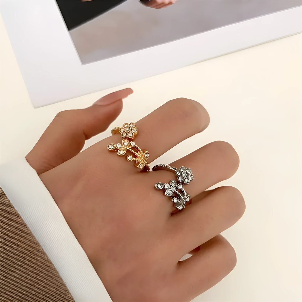 Women's open copper ring with diamond-treated floral and leaf design in gold colour.