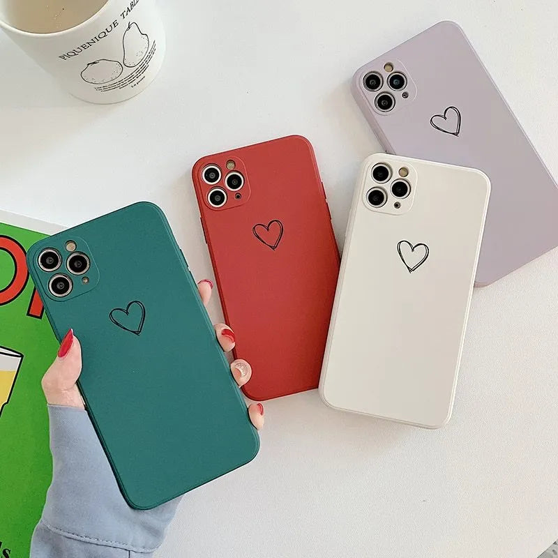 Silicone TPU back cover case for iPhone in solid colours like black, pink, and green on a white background.