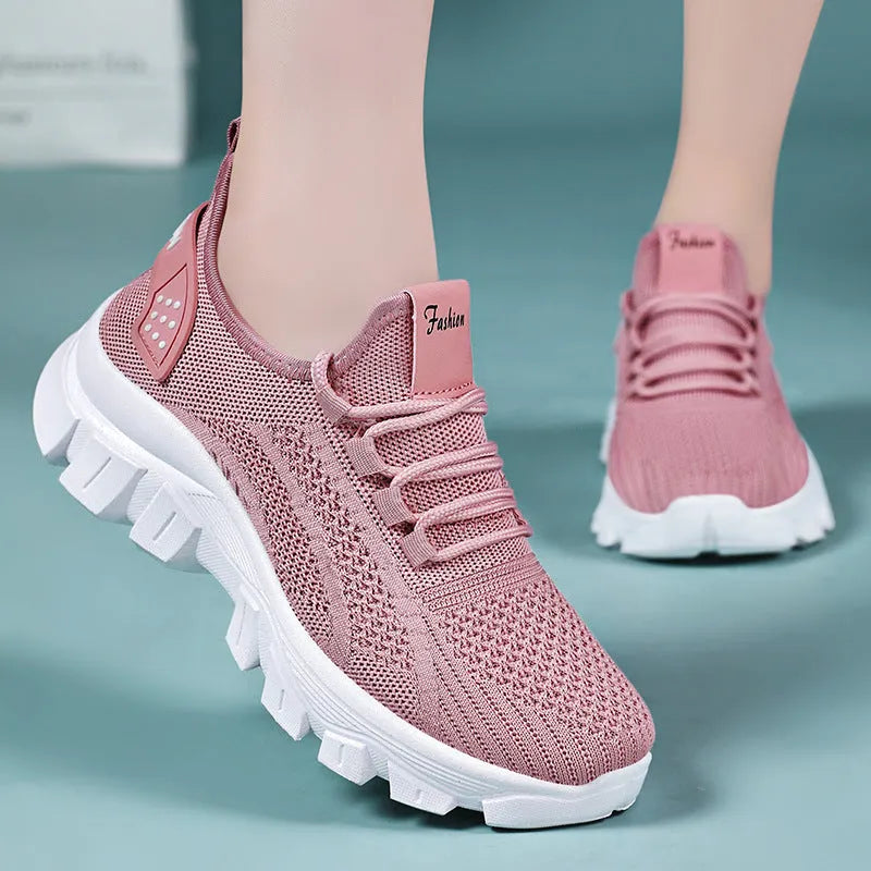 Women's breathable Flyknit sneaker with thick bottom PVC sole and round toe in white, pink, beige, or black.