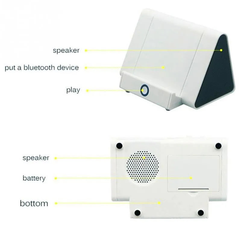Compact black and white wireless Bluetooth mini speaker with control buttons.