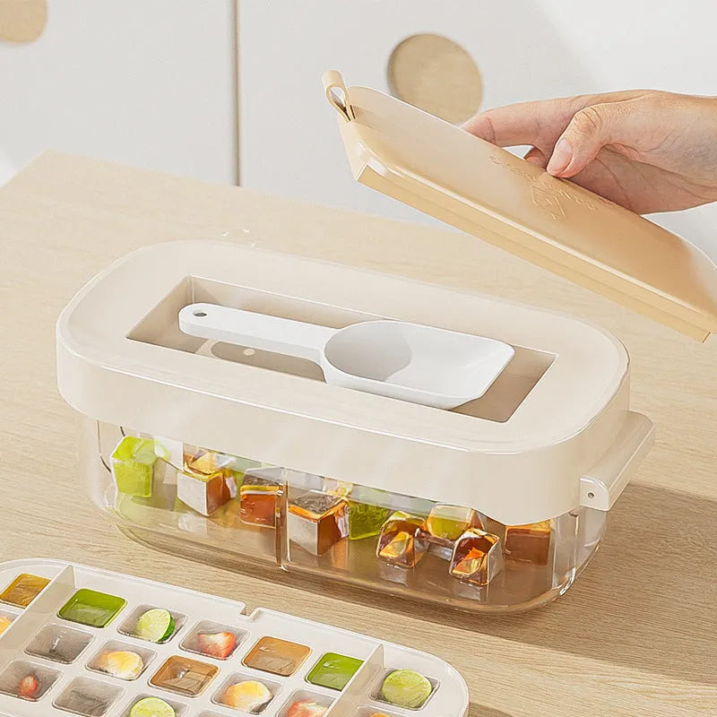 A high capacity plastic ice cube tray with an ice shovel stored in a slot, shown in blue colour.
