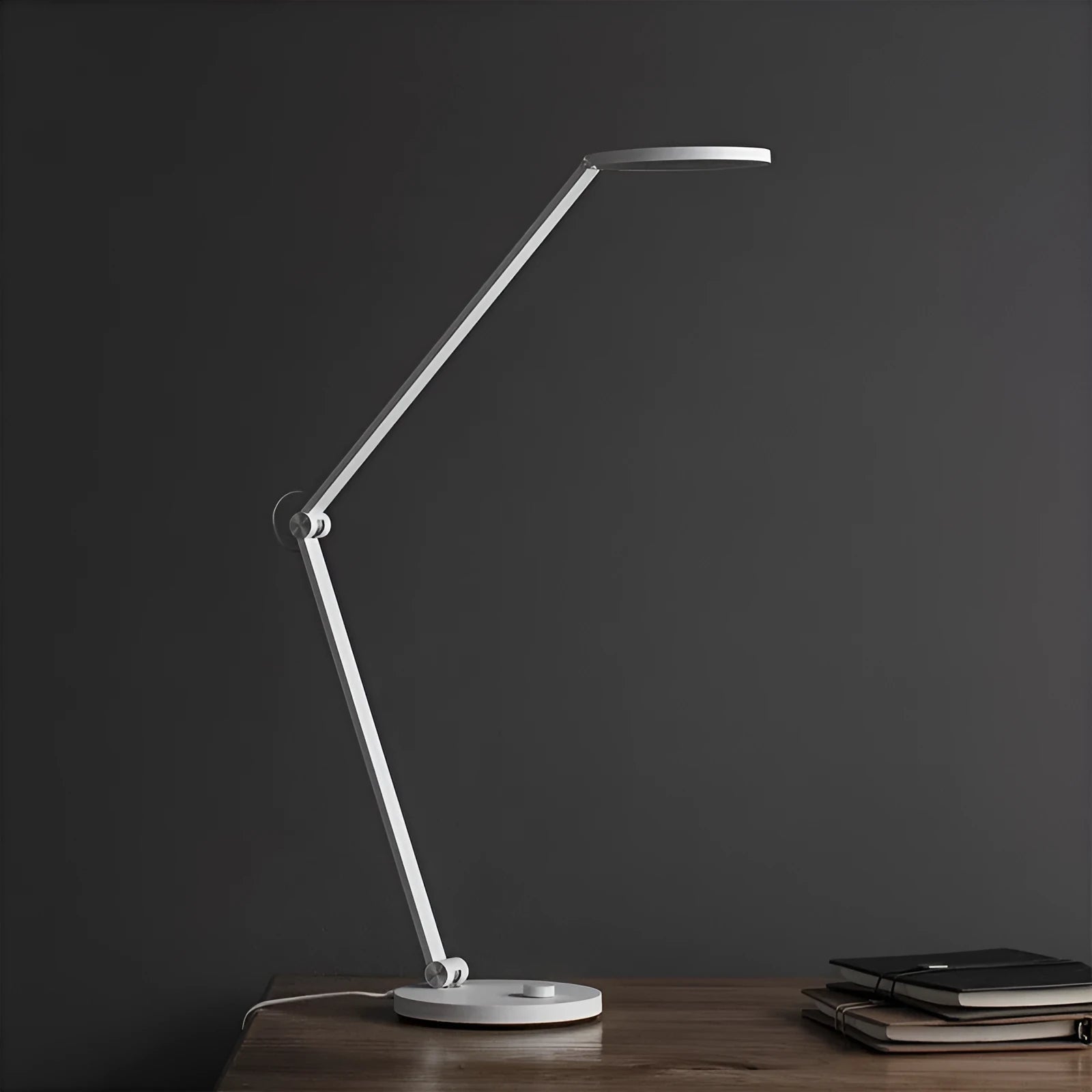 ProLED intelligent desk lamp with a folding arm and adjustable colour temperature settings for reading and writing.