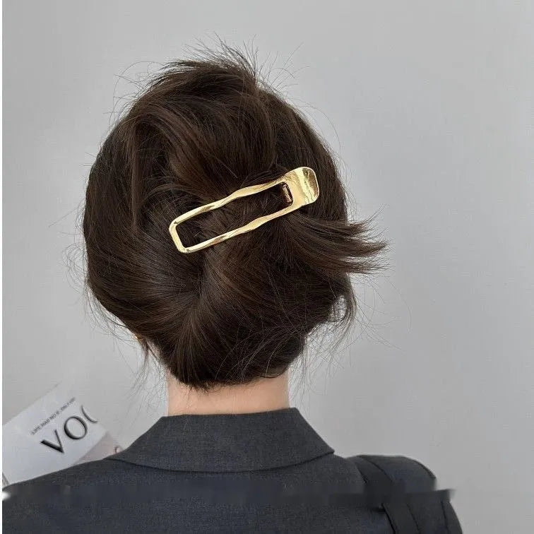 Women's zinc alloy hair barrettes in gold and silver with square, arc and triangle shapes